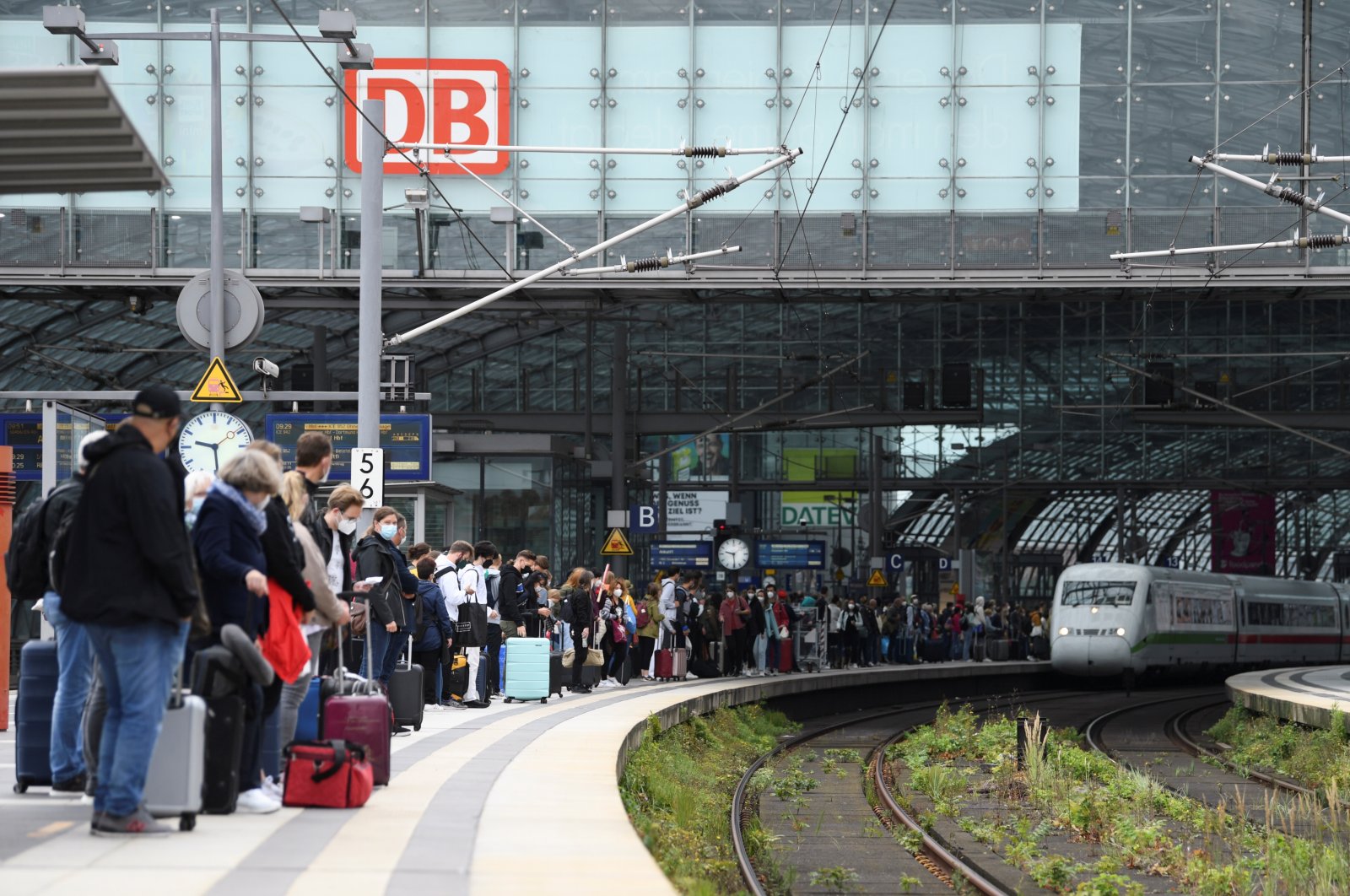 People wait for an arriving train on a platform at Berlin's main railway station during a nationwide rail workers' strike, in Berlin, Germany, Aug. 23, 2021. (Reuters Photo)
