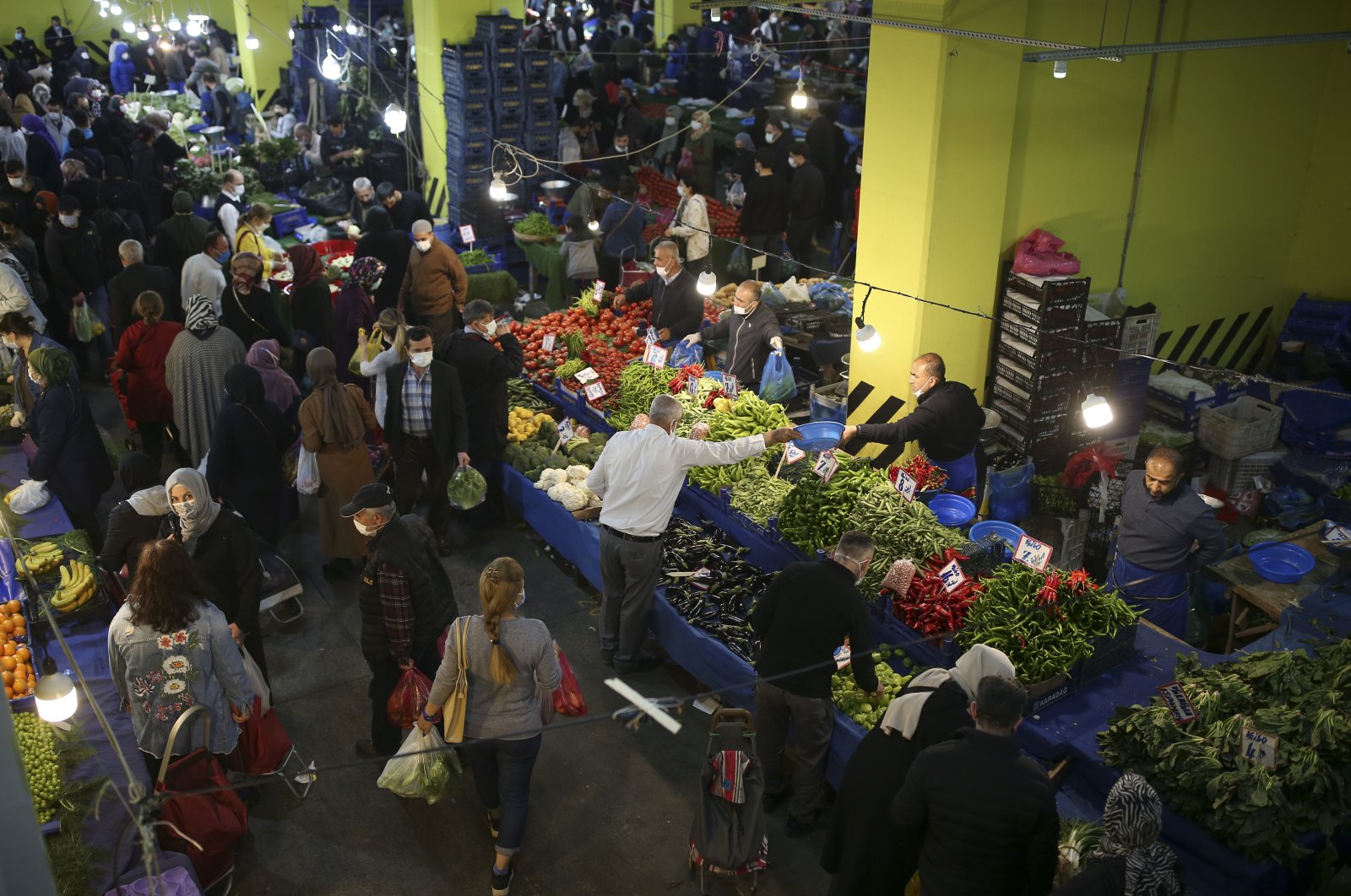 People shop in a street market in Istanbul, Turkey, April 29, 2021. (AP Photo)