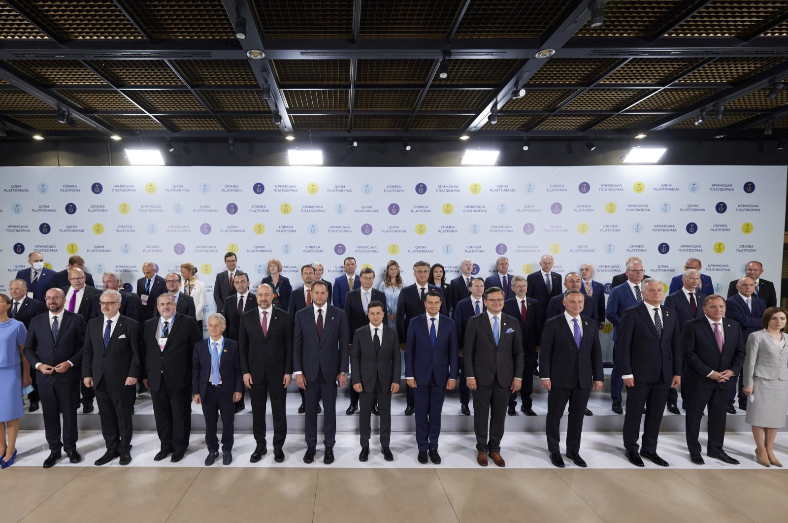 Ukrainian President Volodymyr Zelenskiyy and other officials pose for a group photo during the Crimea Platform summit in Kyiv, Ukraine, Aug. 23, 2021. (AP Photo)