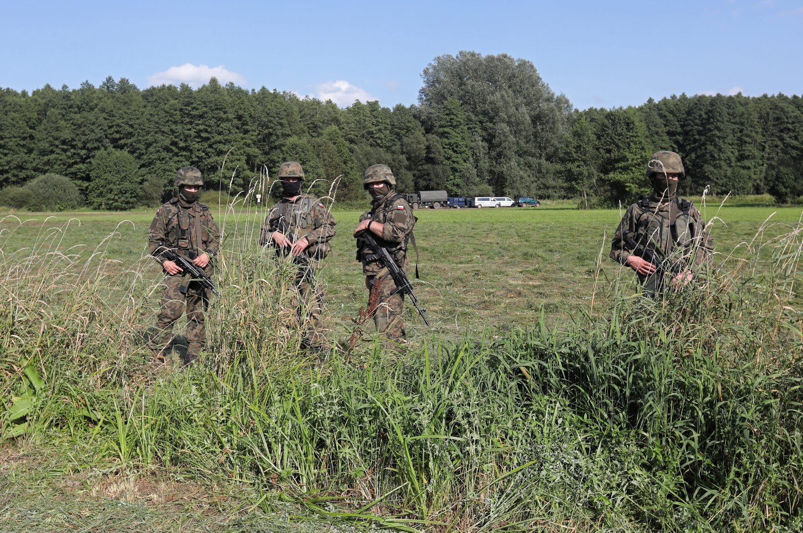 The Border Guard and the army near the town of Usnarz Gorny, northwest Poland, Aug. 22, 2021. (EPA Photo)