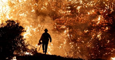 A firefighter battles the Caldor Fire in Grizzly Flats, California, U.S., Aug. 22, 2021. (REUTERS Photo)
