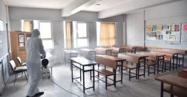 A worker disinfects a classroom at a school in Kartepe district, Kocaeli, northwestern Turkey, Aug. 23, 2021. (IHA PHOTO)