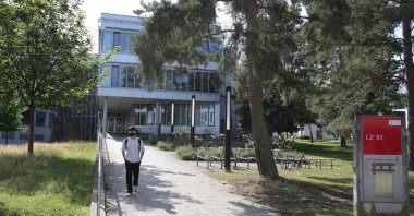 A man leaves the Technical University of Darmstadt in Darmstadt, Germany, Aug. 24, 2021. (AFP Photo)