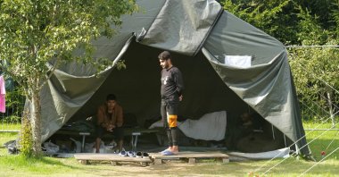 People rest in the migrant camp near Belarus-Lithuania border in Medininkai, Lithuania, Aug. 24, 2021. (Reuters Photo)