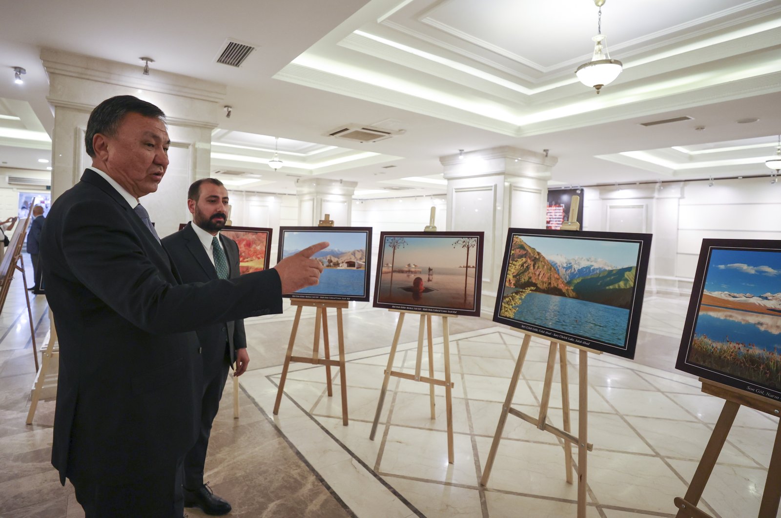 Kyrgyzstan's Ambassador Kubanychbek Omuraliev (L) visits an exhibition to mark the 30th anniversary of the Central Asian nation's independence in the capital Ankara, Turkey, Aug. 23, 2021. (AA Photo)