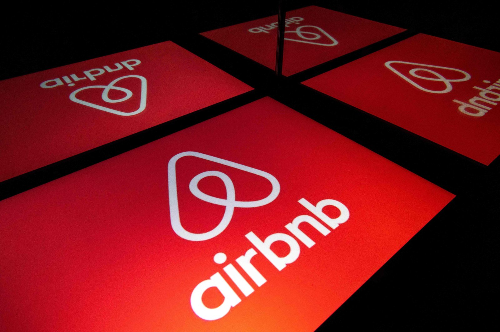 An illustration of the logo of the online accommodation platform Airbnb displayed on a tablet in Paris, Nov. 22, 2019. (AFP Photo)