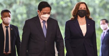 U.S. Vice President Kamala Harris, third from left, walks with Vietnamese Prime Minister Pham Minh Chinh at the government office in Hanoi, Vietnam, Aug. 25, 2021. (AP Photo)