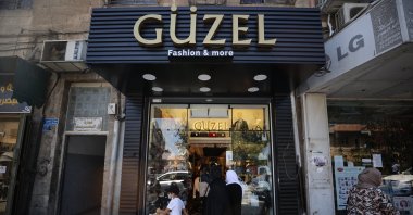 A clothing and accessories shop named Güzel (beautiful in Turkish) is seen along Salah al-Din Street in East Jerusalem, occupied Palestine, Aug. 19, 2021. (AA Photo)