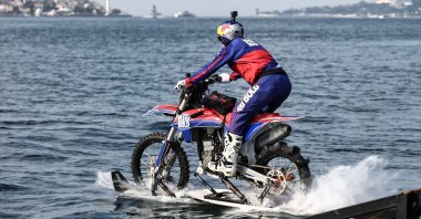 Motocross legend Robbie Maddison crosses the Bosporus on his motorbike. (AA Photo)