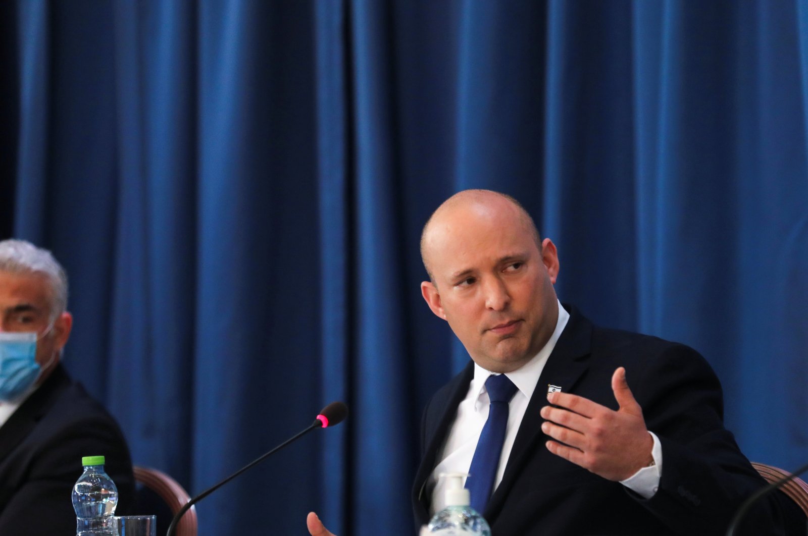 Israeli Prime Minister Naftali Bennett chairs the weekly Cabinet meeting, as Alternate Prime Minister and Foreign Minister Yair Lapid (L) looks on, in West Jerusalem, Israel, Aug. 22, 2021. (Reuters Photo)