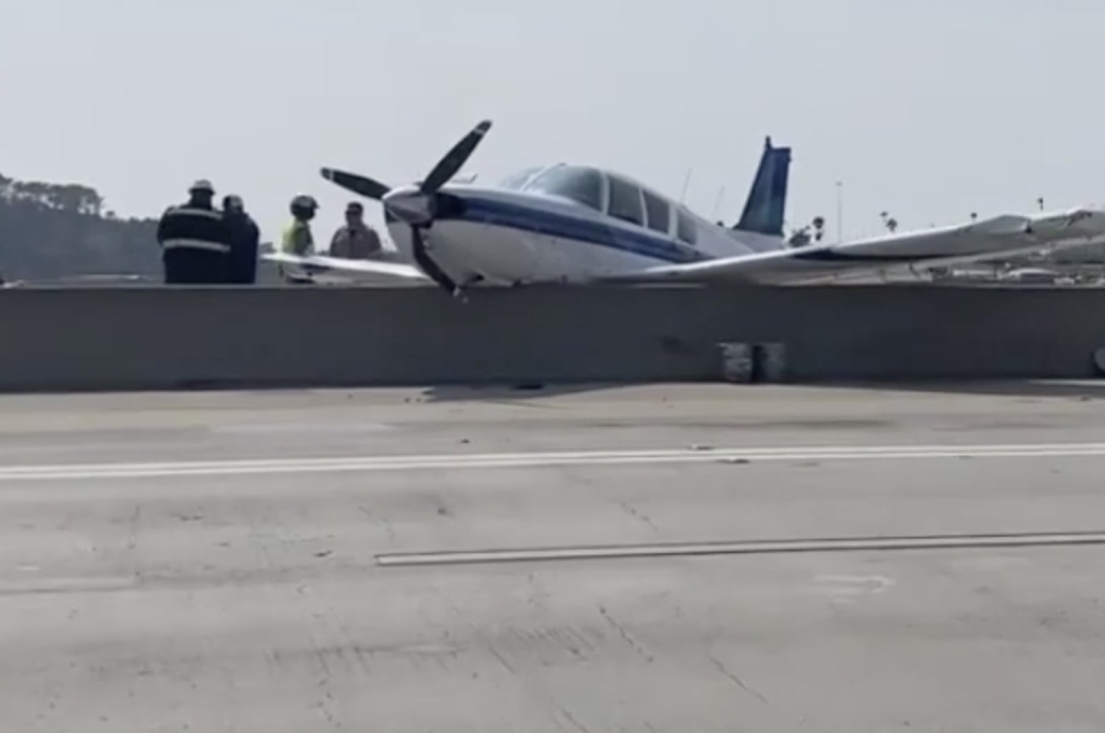 This still image shows a plane after it made an emergency landing at Interstate 5 highway, near San Diego, California, U.S., Aug. 25, 2021.