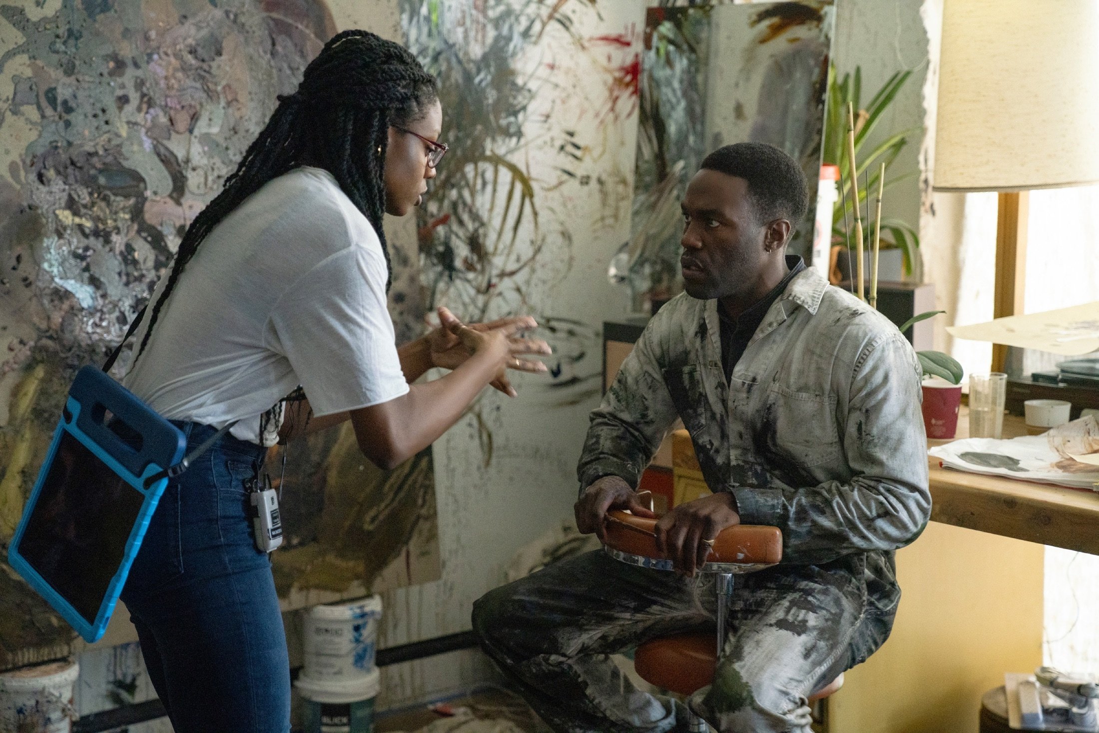 Director Nia DaCosta (L) speaks with Yahya Abdul-Mateen II, on the set of the film “Candyman,” directed by DaCosta. (AP Photo)