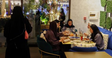 Saudi women sit at David Burke's restaurant, in The Zone restaurant complex, in Riyadh, Saudi Arabia, Aug. 25, 2021. (Reuters Photo)