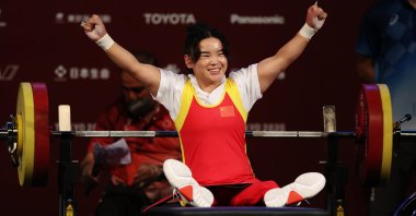 China's Guo Lingling celebrates winning women's 41-kilogram powerlifting gold at the Tokyo 2020 Paralympic Games, Tokyo, Japan, Aug. 26, 2021. (Reuters Photo) 