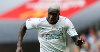 Manchester City's French defender Benjamin Mendy (R) runs with the ball during the English FA Community Shield football match between Manchester City and Leicester City at Wembley Stadium in north London, U.K., Aug. 7, 2021. (AFP Photo)