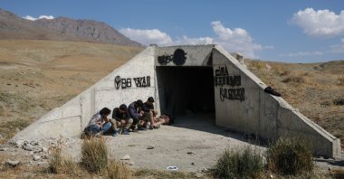 Migrants from Iran wait in front of an underpass in the border city of Van, eastern Turkey, Aug. 13, 2021. (EPA Photo)