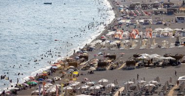People are seen on a beach in the Mediterranean coastal city of Antalya, Turkey, Aug. 24, 2021. (AA Photo)