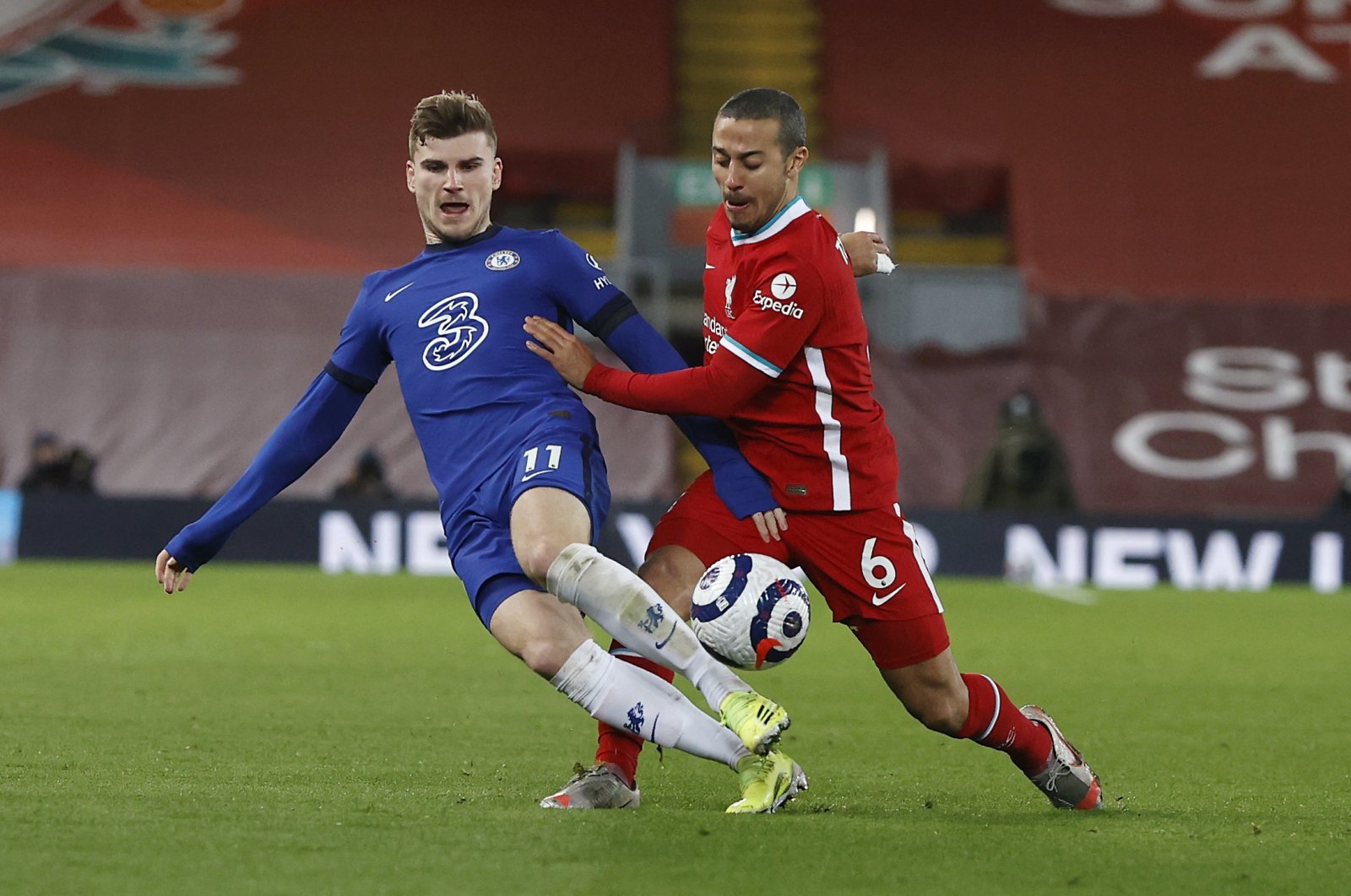 Chelsea's Timo Werner (L) vies for the ball with Liverpool's Thiago during a Premier League match at Anfield stadium in Liverpool, England, March 4, 2021. (AP Photo)