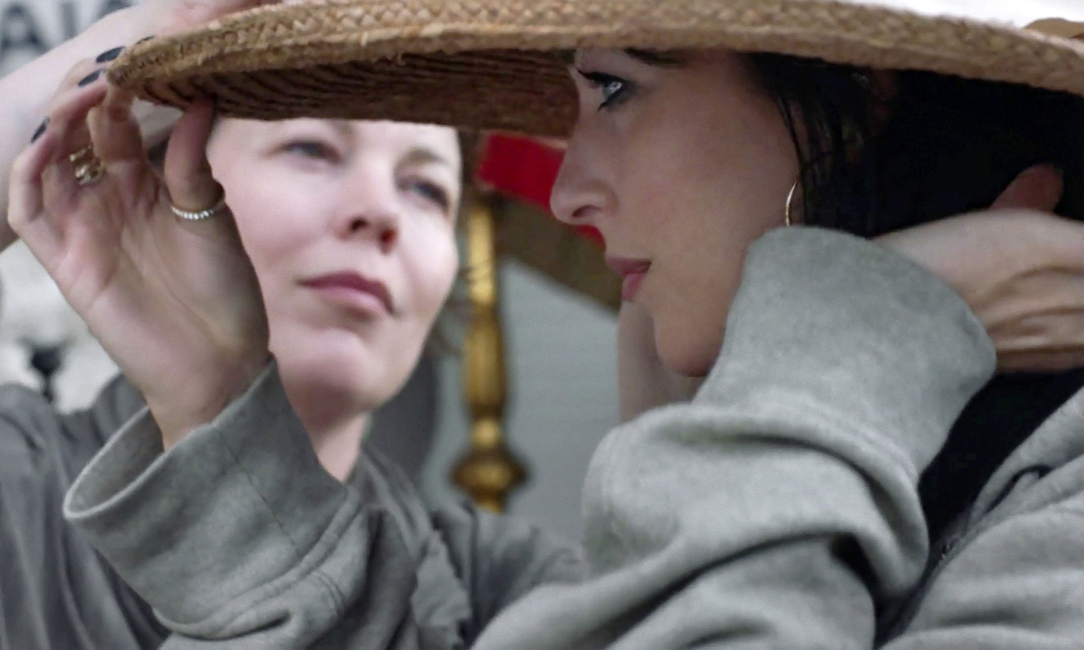 Olivia Colman (L), and Dakota Johnson, in a scene from 'The Lost Daughter.' (Netflix via AP)