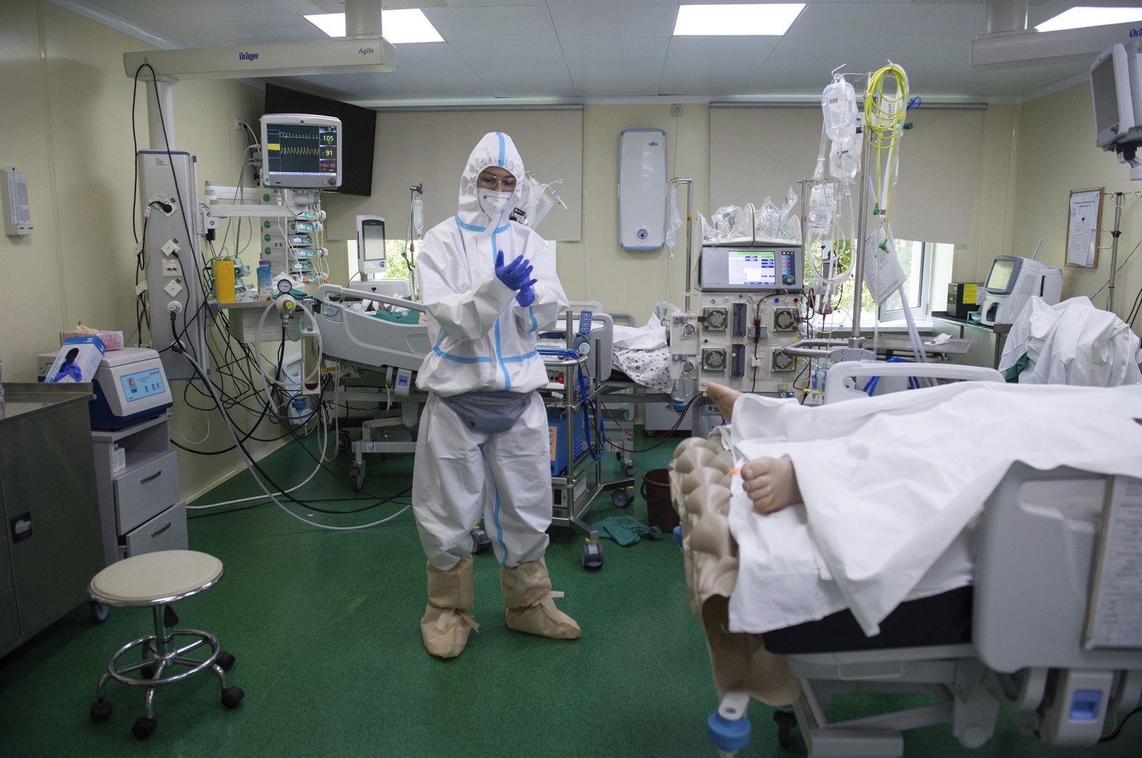 A medic wearing a special suit to protect against coronavirus prepares to treat a patient with coronavirus at the City hospital No. 52 for coronavirus patients in Moscow, Russia, July 13, 2021. (AP Photo)