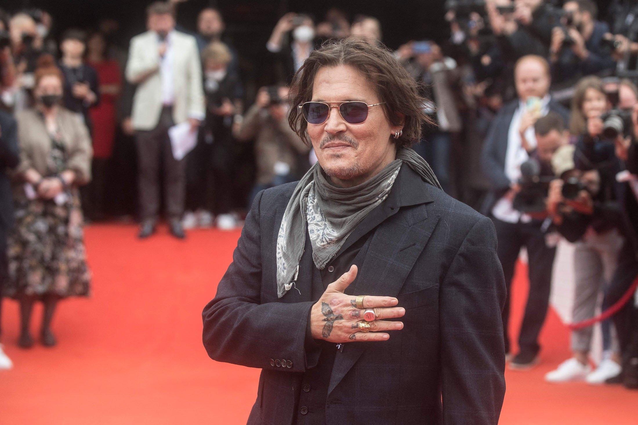 American actor and producer Johnny Depp greets his fans on the red carpet during the 55th edition of the Karlovy Vary International Film Festival (KVIFF) in Karlovy Vary, Czech Republic, Aug. 27, 2021. (AFP Photo)