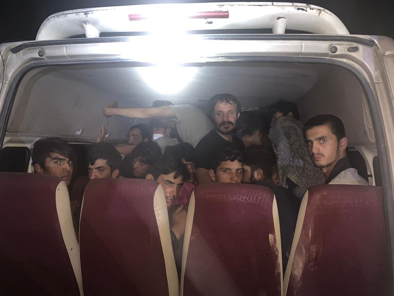Irregular migrants detained in Van's Erciş district inside the minibus, Aug. 29, 2021. (Gendarmerie handout via AA)