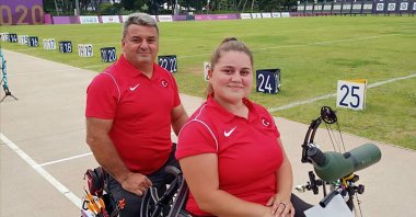 Turkish archers Öznur Cüre (R) and Bülent Korkmaz attend a training session in this undated photo. (AA Photo)