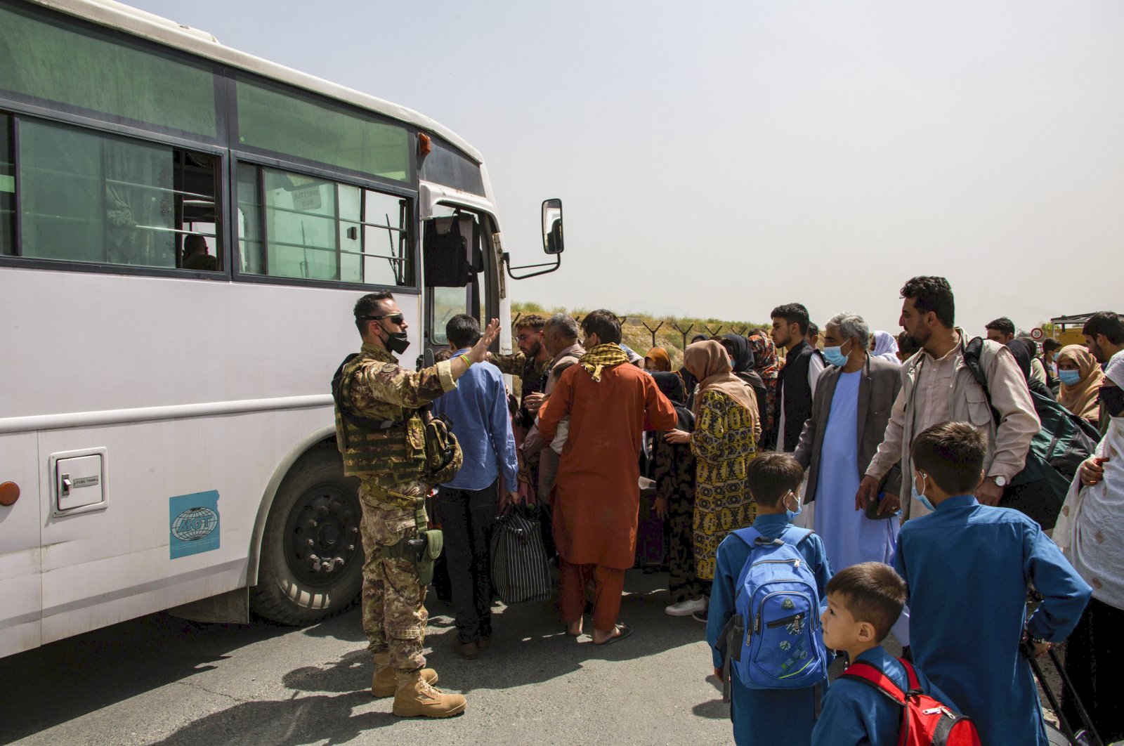 In this image provided by the U.S. Marine Corps, German military members process evacuees at Hamid Karzai International Airport in Kabul, Afghanistan, Aug. 28, 2021. (AP Photo)