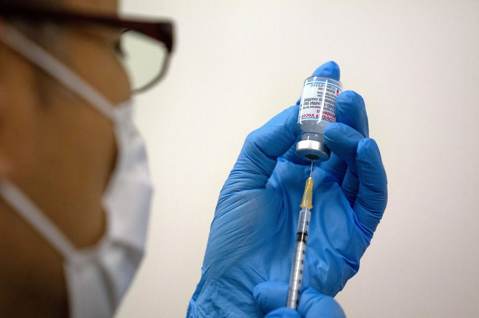 A medical worker prepares a Moderna COVID-19 vaccine to be administered at the newly opened mass vaccination center in Tokyo, Japan, May 24, 2021. (Reuters Photo)