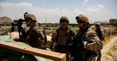 U.S. Marines and German service members watch an entry gate during an evacuation at Hamid Karzai International Airport, Kabul, Afghanistan, Aug. 28, 2021. (Reuters Photo)