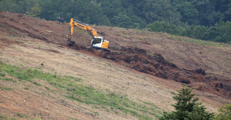 An excavator digs a 5-acre parcel of the forest near the village of Issancourt-et-Rumel as searches for the remains of 9-year-old girl Estelle Mouzin, who disappeared in 2003, resume. (AFP Photo)