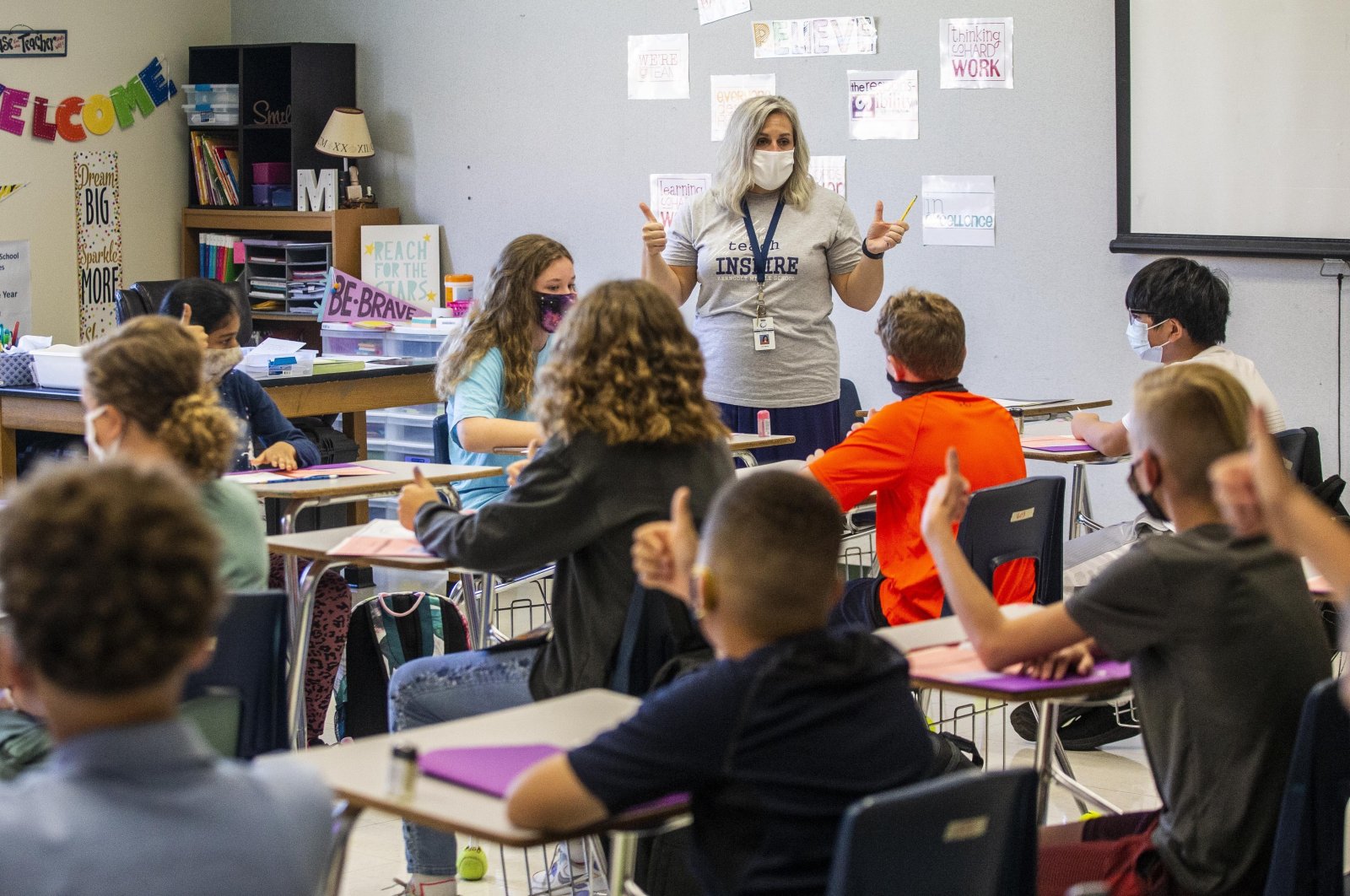 A teacher talks to her students on the first day of school at a middle school in Greensboro, U.S., Aug. 23, 2021. (AP Photo)