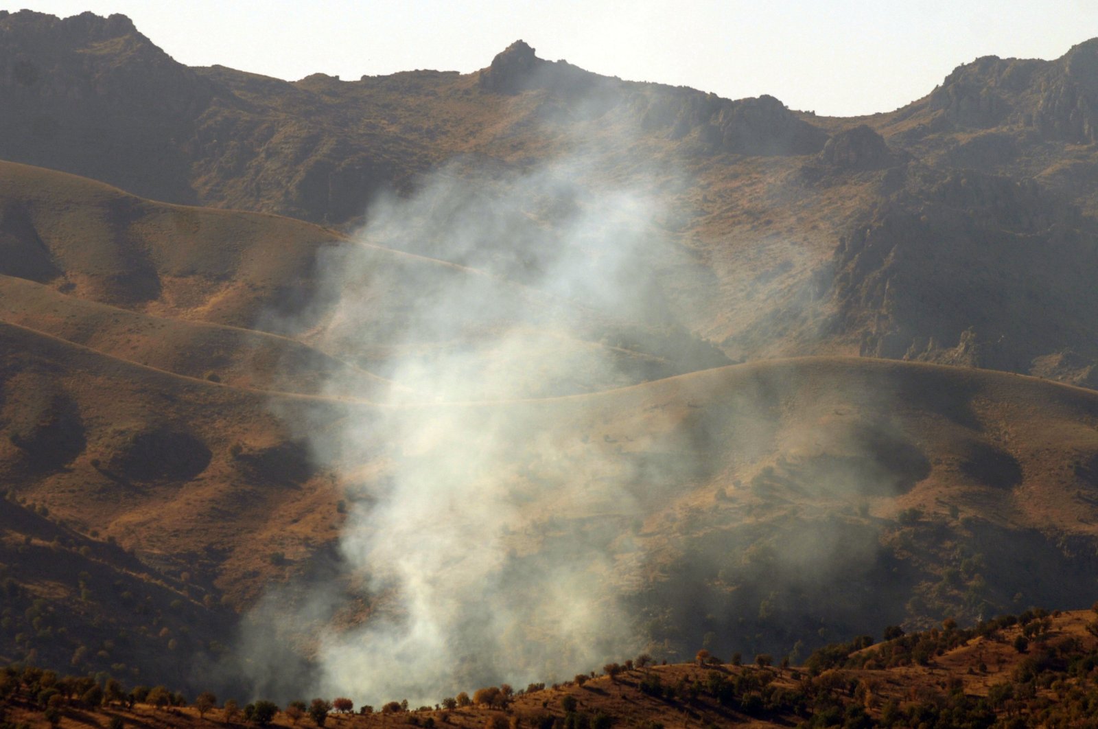 Smoke billows from Cudi mountain, near the Iraqi border in the southeastern province of Şırnak, Turkey, Oct. 30, 2007. (Burak Kara via Getty Images)
