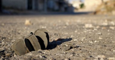 A picture shows the remains of a mortar shell in the Syrian district of Daraa al-Balad deserted following fighting between regime forces and armed opposition groups in Syria's southern province of Daraa, Aug. 16, 2021. (AFP Photo)
