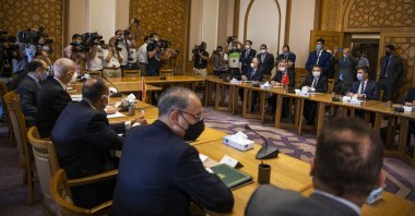 Turkish Foreign Ministry Deputy Sedat Onal, seated (2-R), meets with Hamdi Sanad Loza, Egyptian deputy foreign minister, (4-L), and their delegations, at the Foreign Ministry in Cairo, Egypt, Wednesday, May 5, 2021. (AP File Photo)