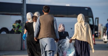 Afghan refugees who supported Canada's mission in Afghanistan arrive at Toronto Pearson International Airport, Toronto, Canada, on Aug. 24, 2021. (Canadian Armed Forces Handout via Reuters)