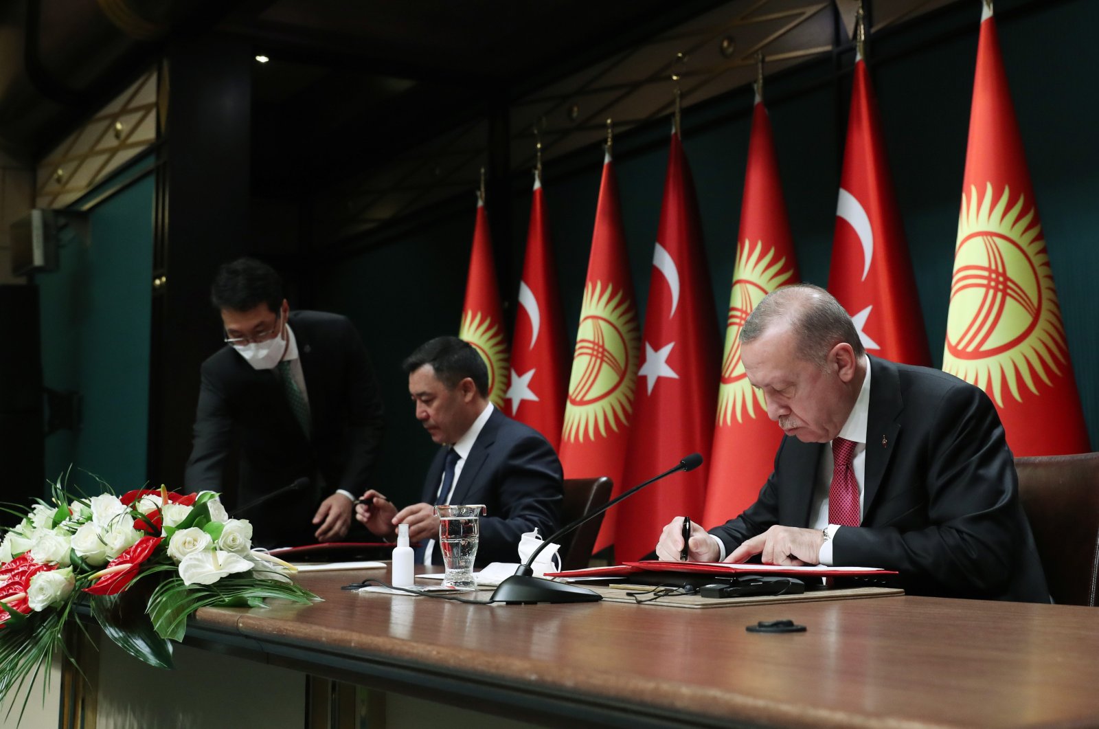 President Recep Tayyip Erdoğan signs agreements after meeting with Kyrgyz counterpart Sadyr Japarov in Ankara, June 10, 2021. (AA File Photo)