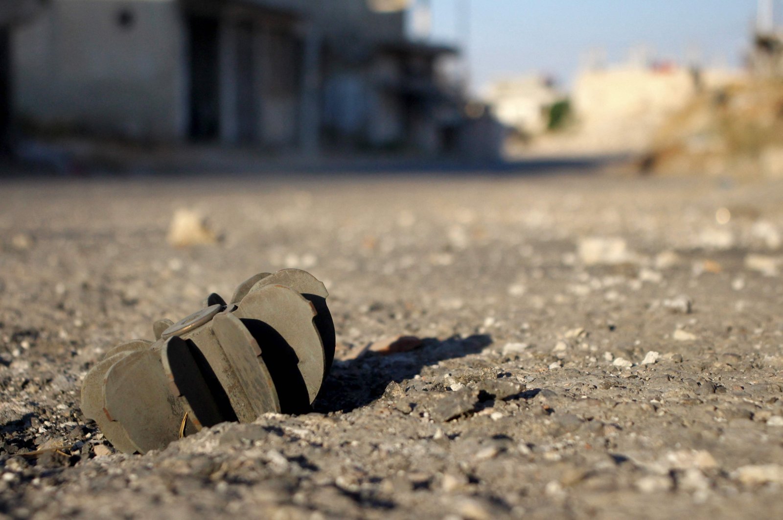 A picture shows the remains of a mortar shell in the Syrian district of Daraa al-Balad deserted following fighting between regime forces and armed opposition groups in Syria's southern province of Daraa, Aug. 16, 2021. (AFP Photo)