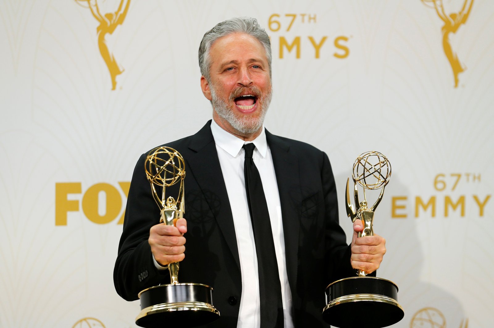Jon Stewart holds his awards for Comedy Central's "The Daily Show With Jon Stewart" during the 67th Primetime Emmy Awards in Los Angeles, California, U.S., Sept. 20, 2015. (Reuters Photo)