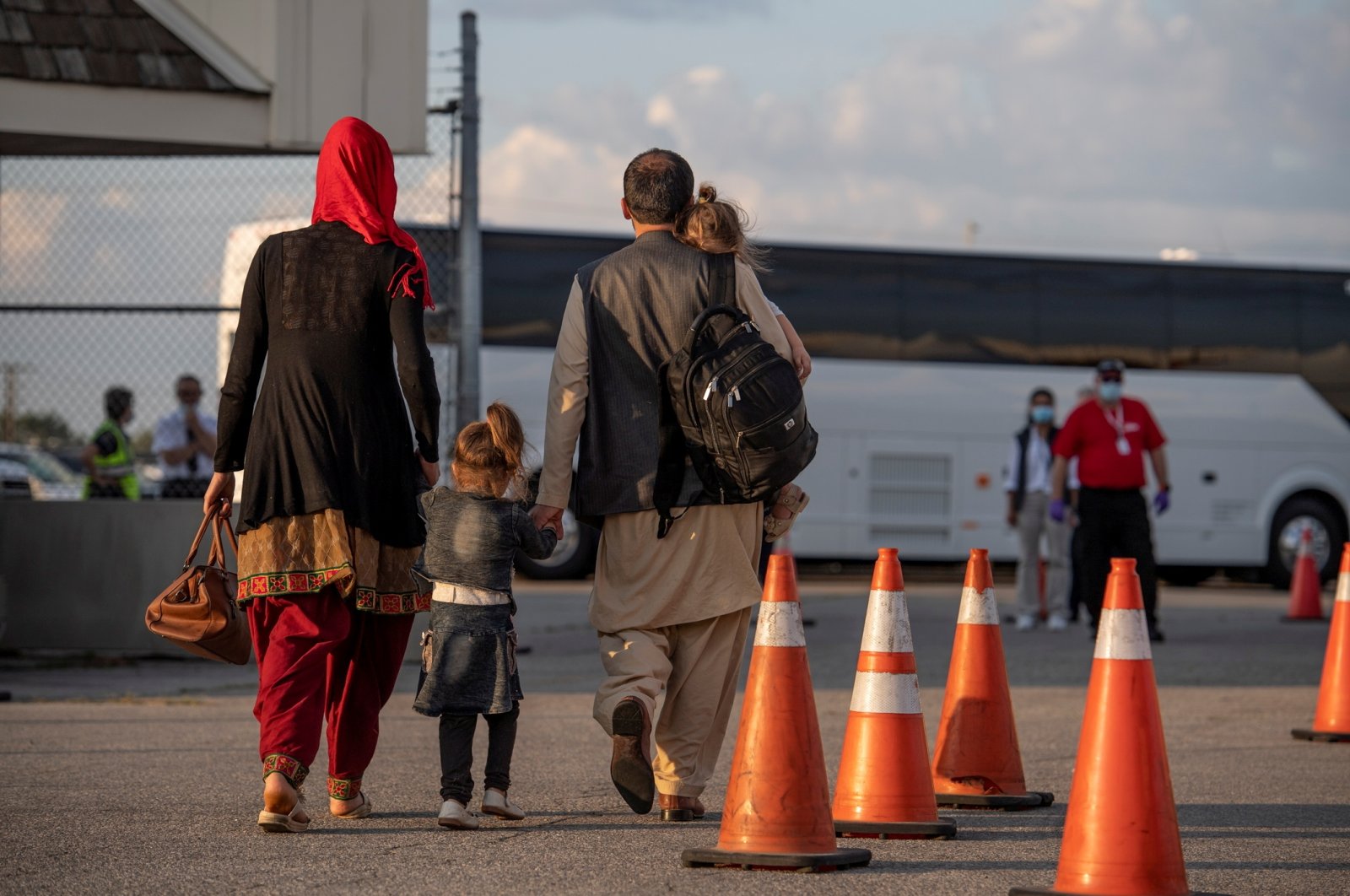 Afghan refugees who supported Canada's mission in Afghanistan prepare to board buses after arriving at Toronto Pearson International Airport, Toronto, Canada, Aug. 24, 2021. (Reuters Photo)