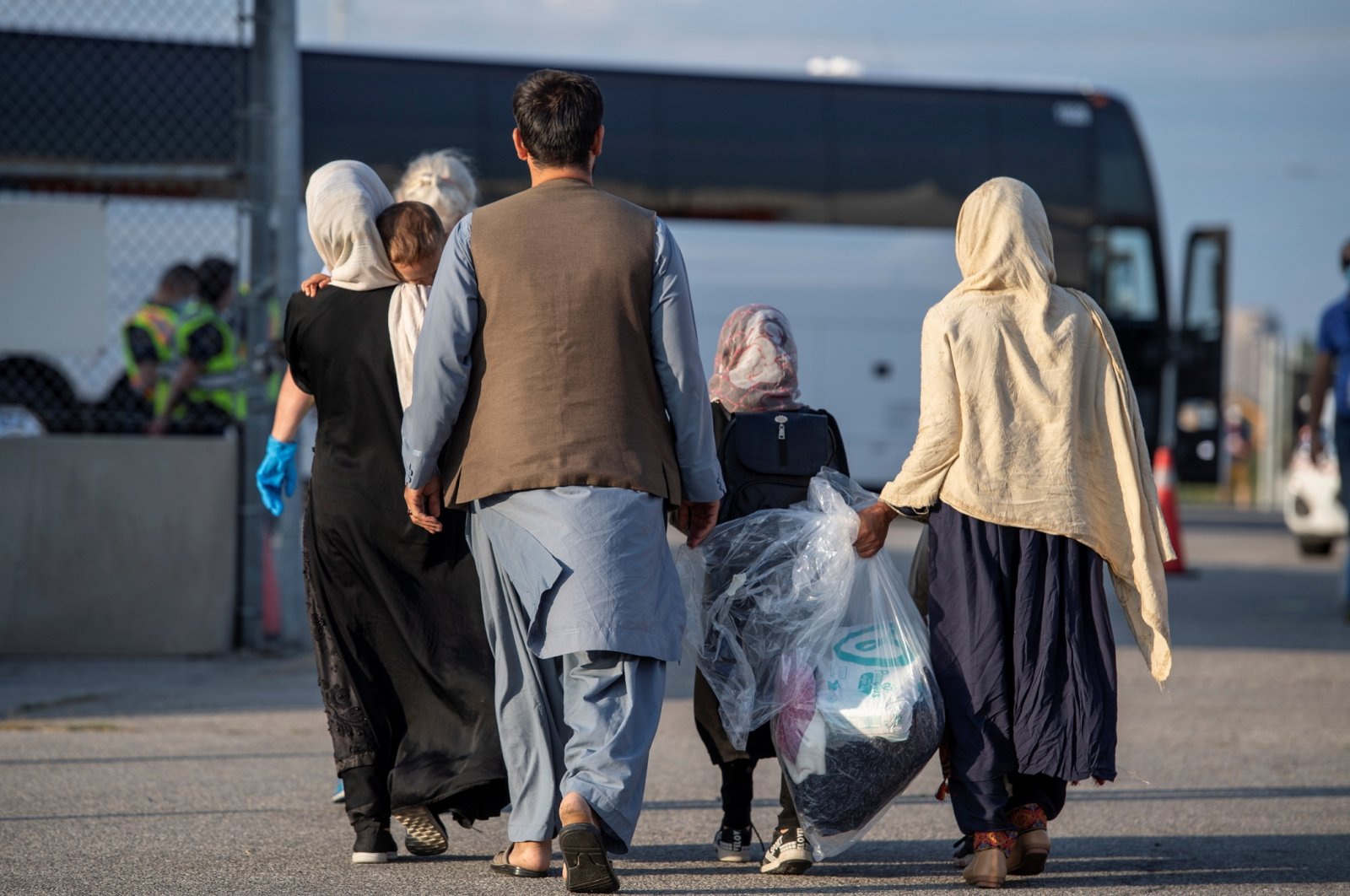 Afghan refugees who supported Canada's mission in Afghanistan arrive at Toronto Pearson International Airport, Toronto, Canada, on Aug. 24, 2021. (Canadian Armed Forces Handout via Reuters)