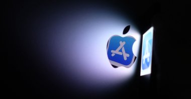 This illustration photo shows the Apple app store logo reflected from an iPhone onto the back of an iMac in Los Angeles, Aug. 26, 2021. (AFP Photo)