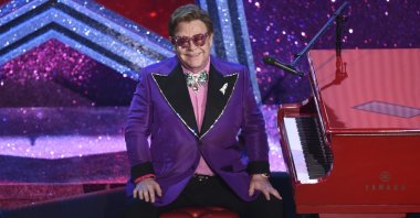 Sir Elton John sits after performing "(I'm Gonna) Love Me Again" from the film "Rocketman," which was nominated for the Best Original Song award at the Oscars, at the Dolby Theater, Los Angeles, U.S., Feb. 9, 2020. (AP Photo)