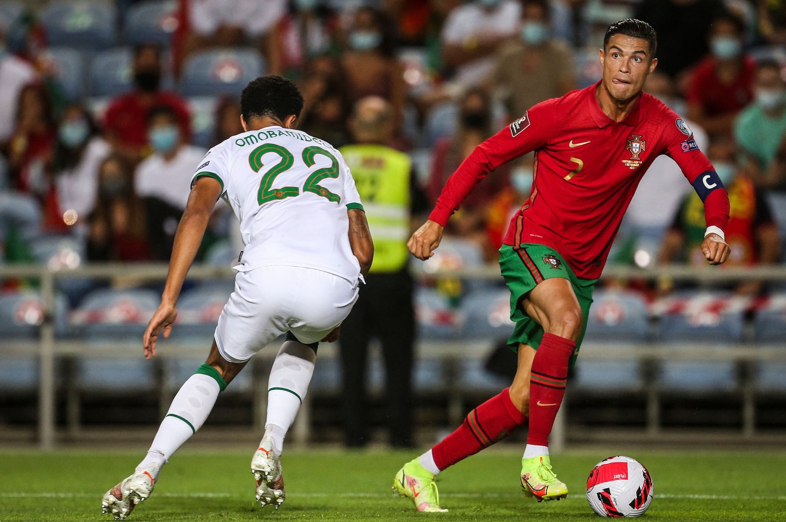 Portugal forward Cristiano Ronaldo (R) goes past Republic of Ireland defender Andrew Omobamidele during their World Cup European qualifying match in Faro, southern Portugal, Sept. 1, 2021. (AFP Photo)