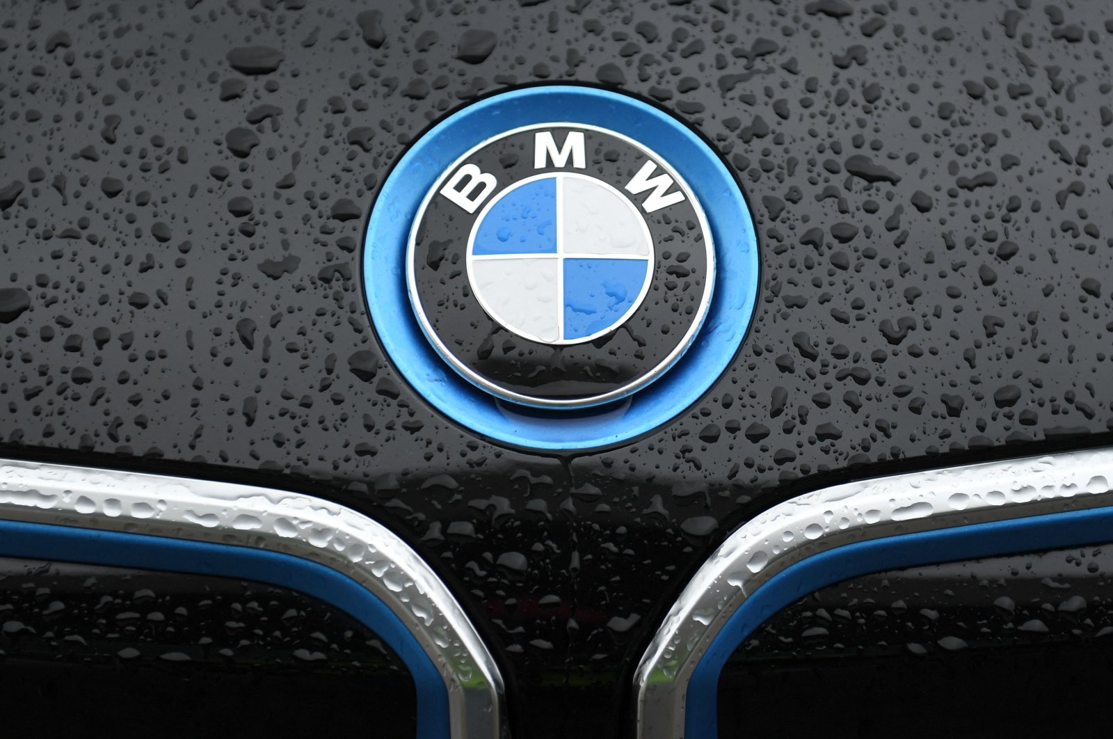 The logo of German carmaker BMW is pictured on a BMW car in Munich, southern Germany, March 15, 2021. (AFP Photo)