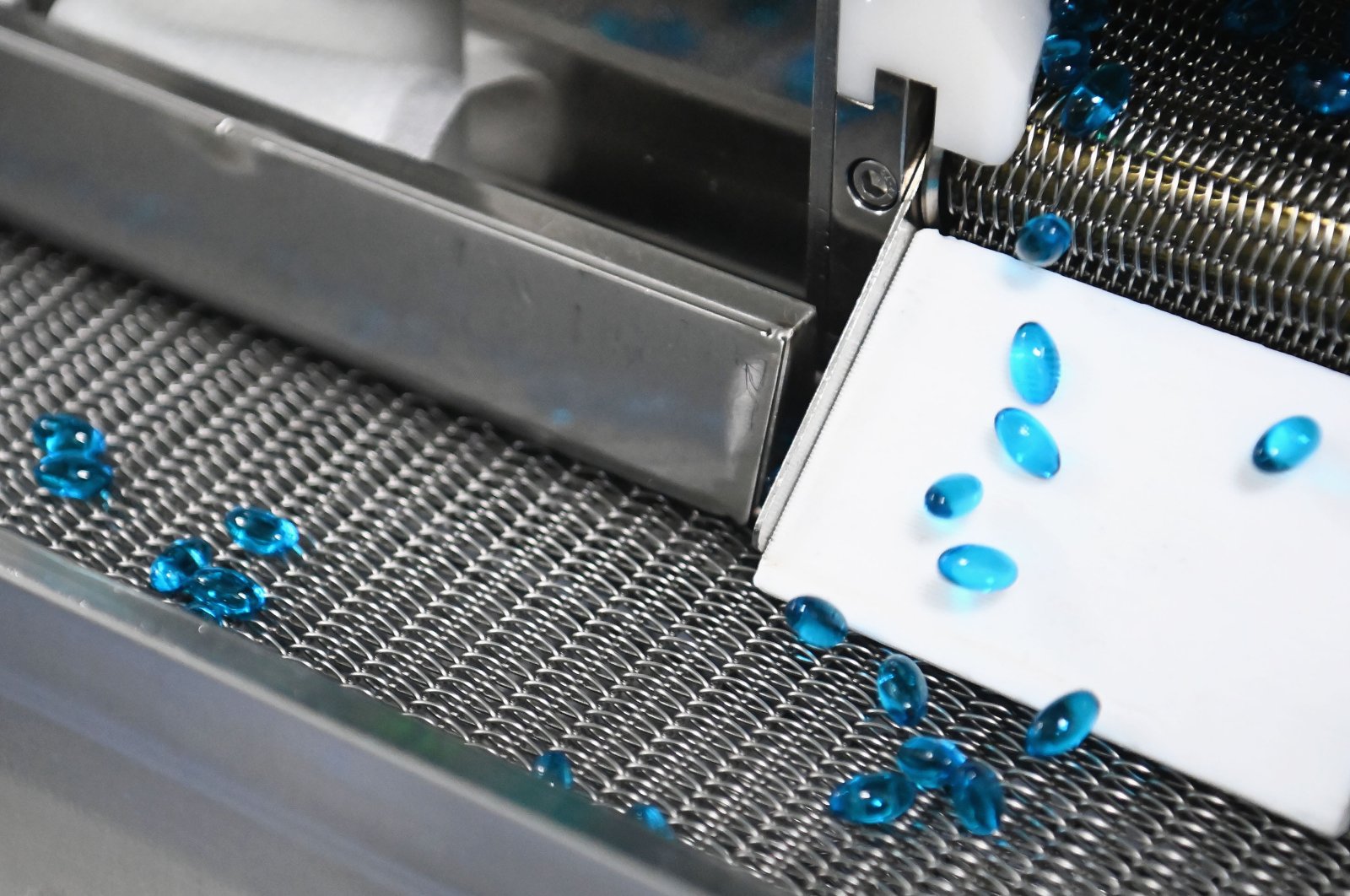 Capsules for treating cold move along a conveyor at a factory in Wuhan, Hubei province, China, Aug. 11, 2021. (Getty Images )