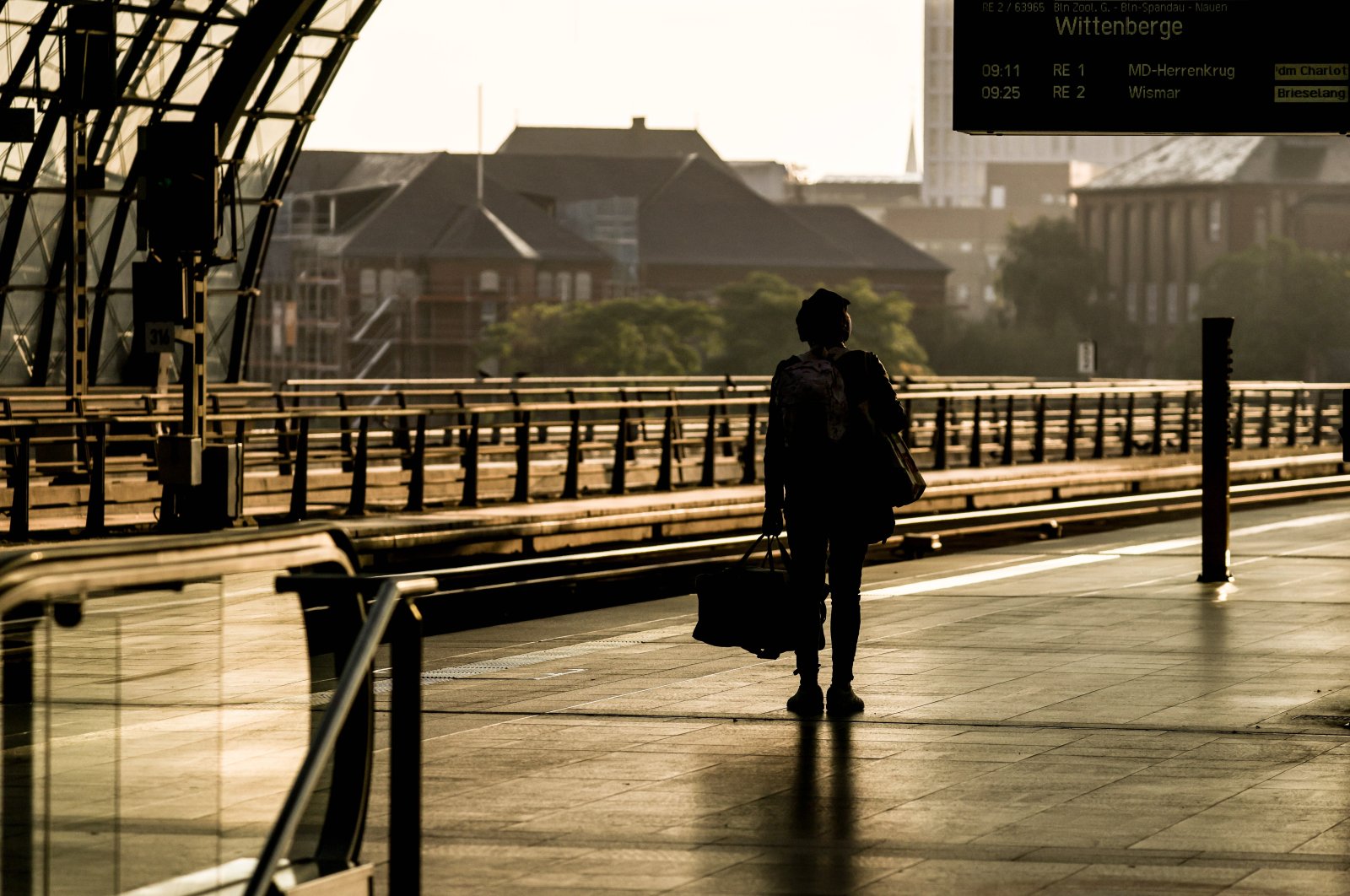 A passenger stands on an empty platform during the German Train Drivers' Union (GDL) strike at Berlin Central Railway Station in Berlin, Germany, Sept. 2, 2021. (EPA Photo)