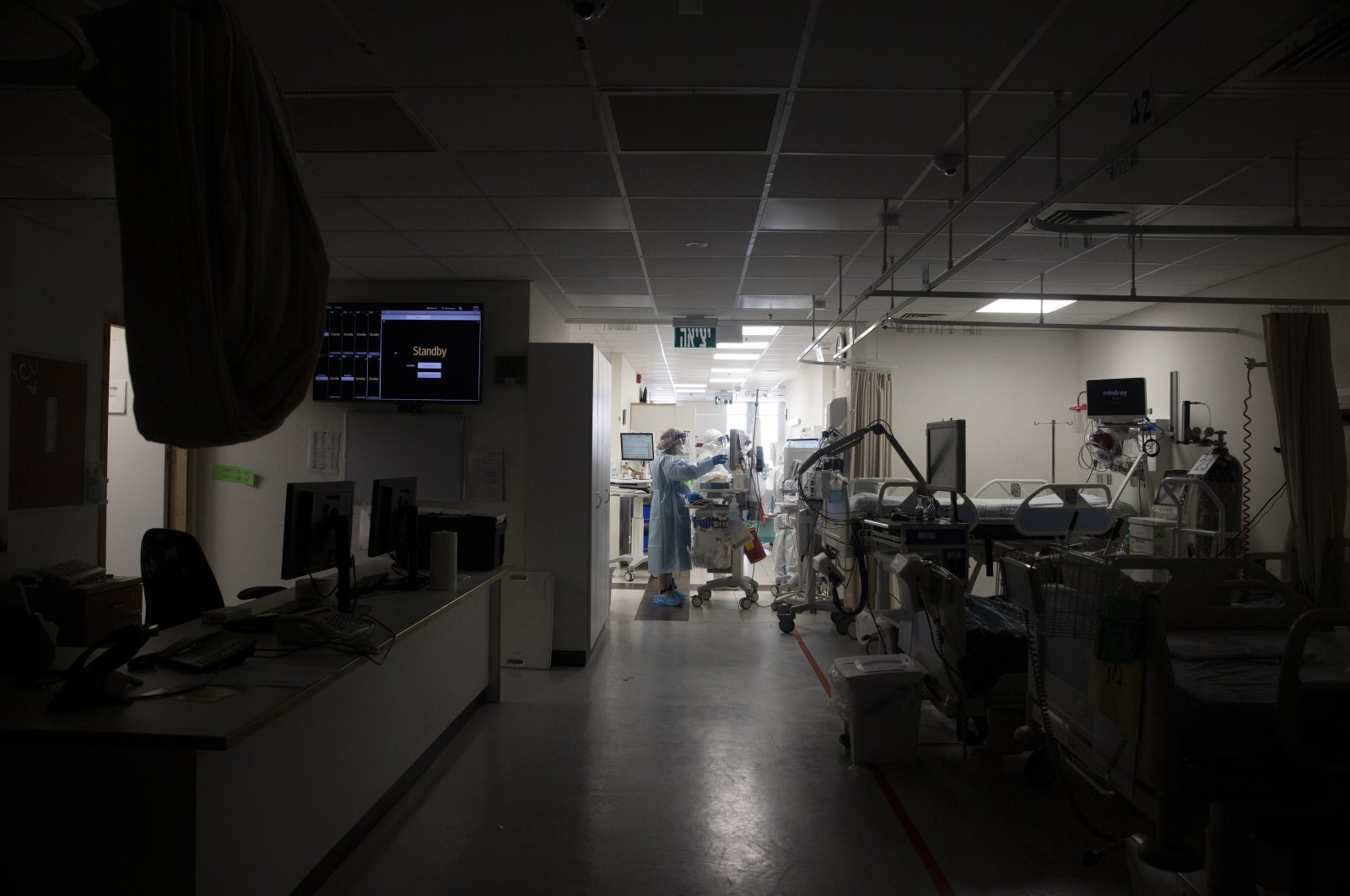 A darkened corridor of empty beds is prepared for patients on the COVID-19 ward at Shaare Zedek Medical Center in West Jerusalem, Israel, Aug. 31, 2021. (AP Photo)