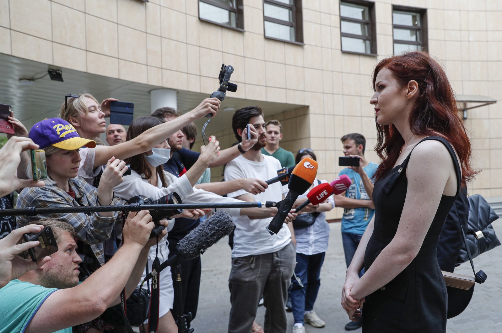 Alexei Navalny's spokesperson Kira Yarmysh (R) speaks to journalists while leaving the Preobrazhensky district court after a hearing in Moscow, Russia, Aug. 16, 2021. (EPA Photo / Maxim Shipenkov)