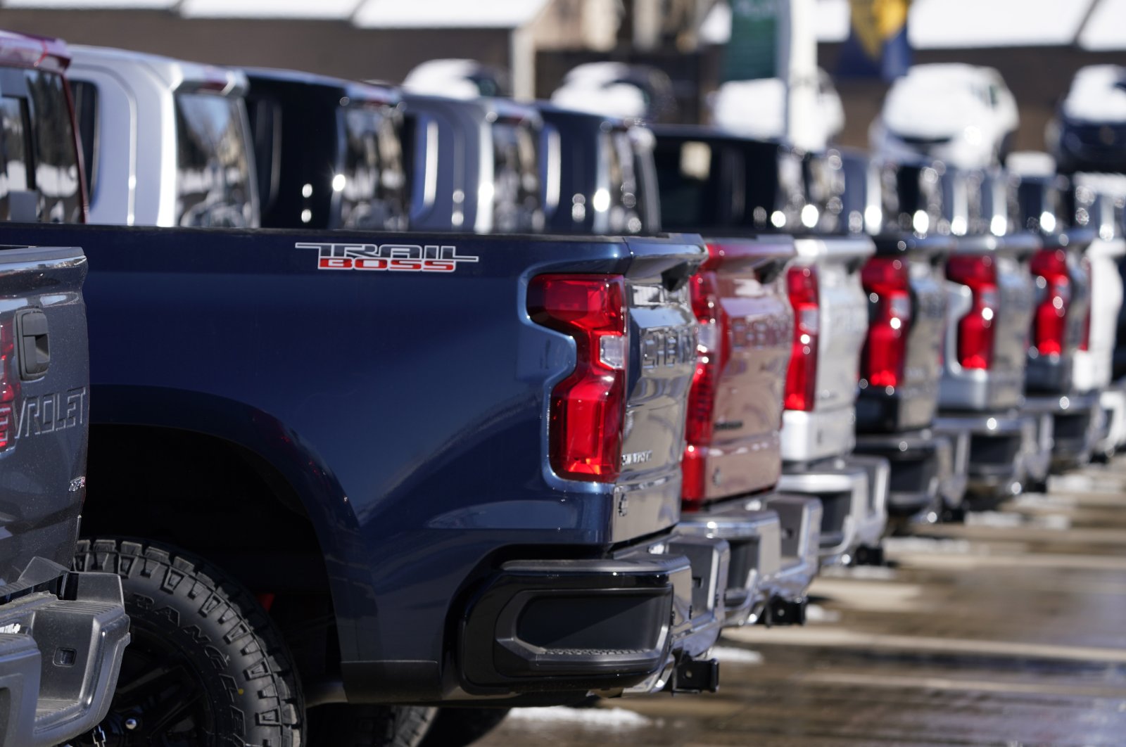 A long line of unsold 2021 Silverado pickup trucks sits at a Chevrolet dealership in Englewood, U.S., Feb. 21, 2021. (AP Photo)